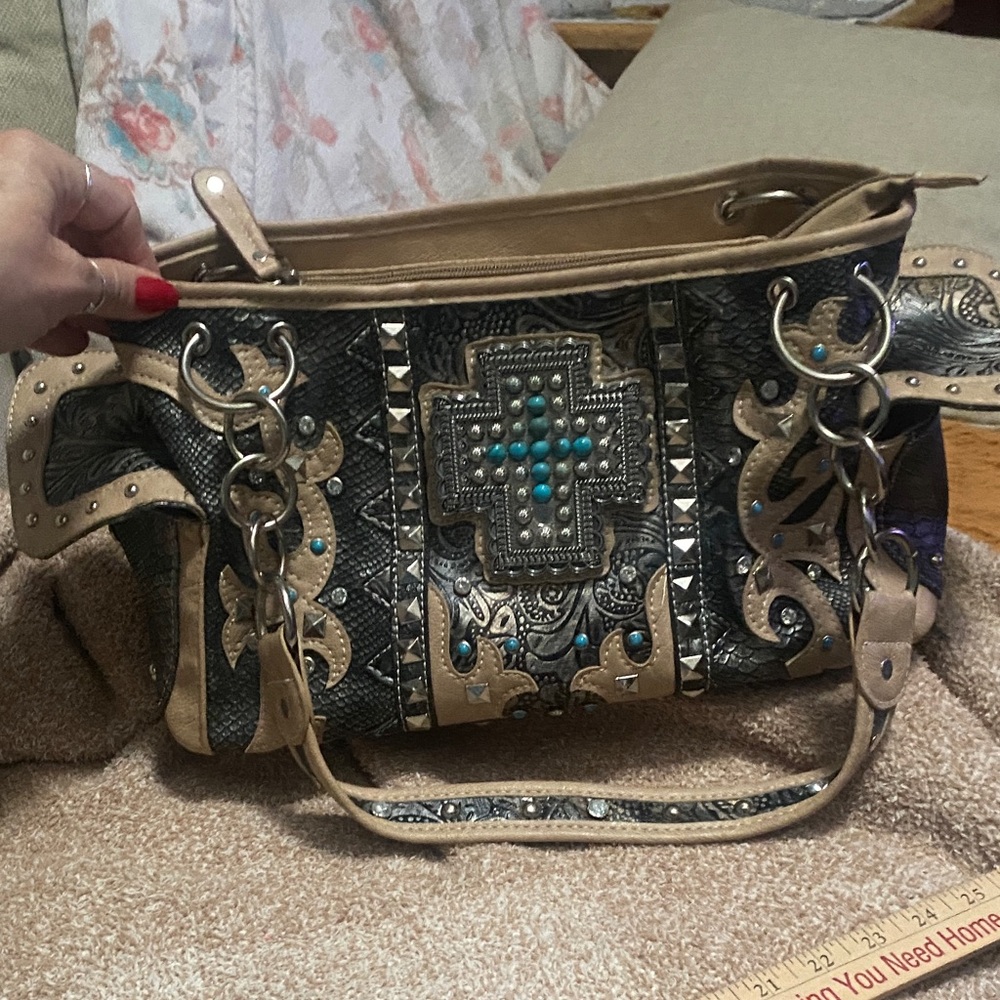 Western-Inspired Black and Tan Shoulder Bag with Turquoise Cross Detail